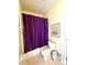 Bathroom featuring a shower/tub combination with a purple shower curtain at 401 Chinahill Ct, Apopka, FL 32712