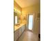 Bathroom with a modern vanity, a large mirror, and a door to the exterior at 401 Chinahill Ct, Apopka, FL 32712
