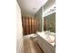 Bathroom with a shower/tub combination and a single sink vanity at 401 Chinahill Ct, Apopka, FL 32712