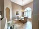 Elegant dining room featuring a glass table with seating for six and a chandelier at 401 Chinahill Ct, Apopka, FL 32712