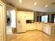 Spacious kitchen featuring white appliances, tile floors and plenty of counter space at 401 Chinahill Ct, Apopka, FL 32712