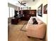 Inviting living room with carpet, a comfortable couch, built-in shelving, and natural light from large windows at 401 Chinahill Ct, Apopka, FL 32712