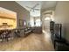 Cozy living room area with sofas, tile flooring, vaulted ceilings, and a view of the kitchen at 401 Chinahill Ct, Apopka, FL 32712