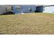 Spacious backyard with a well-maintained lawn, perfect for outdoor activities and entertaining at 443 Cool Summer Ln, Davenport, FL 33837