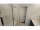 Modern bathroom featuring a glass shower and a sink with a dark vanity at 443 Cool Summer Ln, Davenport, FL 33837