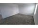Large bedroom with neutral walls and plush gray carpet at 443 Cool Summer Ln, Davenport, FL 33837