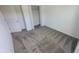 Cozy bedroom featuring neutral gray carpeting and a closet for optimal storage at 443 Cool Summer Ln, Davenport, FL 33837