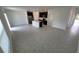 Spacious living area leading to the bright kitchen provides an open-concept design with seamless flow at 443 Cool Summer Ln, Davenport, FL 33837
