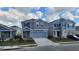 Street view showcases the home's inviting facade and its location within a well-planned residential area at 443 Cool Summer Ln, Davenport, FL 33837