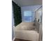 Relaxing bathtub with a jacuzzi, bright window, and tiled walls, a peaceful space at 4447 Maple Chase Trl, Kissimmee, FL 34758
