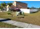 Exterior view of home showcasing a fenced yard and landscaping at 4447 Maple Chase Trl, Kissimmee, FL 34758