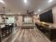 A view of the open floor plan highlighting the living area and seamlessly connected kitchen space at 4447 Maple Chase Trl, Kissimmee, FL 34758