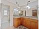 Well-lit bathroom featuring a double vanity with granite countertops and modern globe pendant lighting at 4505 Kissimmee Park Rd, St Cloud, FL 34772