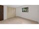 Bright and simple bedroom with a window and closet, offering a serene atmosphere at 4505 Kissimmee Park Rd, St Cloud, FL 34772