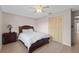 Cozy bedroom with a comfortable bed, wooden floors, closet and neutral color, providing a relaxing space at 4505 Kissimmee Park Rd, St Cloud, FL 34772
