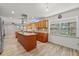 Open-concept kitchen with a central island, stainless steel appliances, and bright lighting at 4505 Kissimmee Park Rd, St Cloud, FL 34772