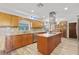 Spacious kitchen featuring a central island, stainless steel appliances, and granite countertops at 4505 Kissimmee Park Rd, St Cloud, FL 34772