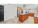 Open kitchen featuring stainless steel appliances, granite countertops and central island, perfect for gatherings at 4505 Kissimmee Park Rd, St Cloud, FL 34772