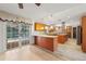 Open-concept kitchen with stainless steel appliances, granite countertops, and wood cabinetry at 4505 Kissimmee Park Rd, St Cloud, FL 34772