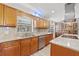Beautiful kitchen featuring granite countertops, stainless steel appliances, and an abundance of cabinet space at 4505 Kissimmee Park Rd, St Cloud, FL 34772
