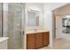 Well-lit bathroom featuring a tiled shower, neutral vanity, and ceramic tile floors at 4720 Doral Pointe Dr, Kissimmee, FL 34758