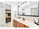 Well lit bathroom features a sink with black fixtures and a doorway to an office area at 4720 Doral Pointe Dr, Kissimmee, FL 34758