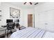 This bedroom includes a ceiling fan, a double closet, and a desk setup with two monitors and an office chair at 4720 Doral Pointe Dr, Kissimmee, FL 34758