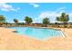 Large community pool with lounge chairs, playground, and well-maintained landscaping at 4720 Doral Pointe Dr, Kissimmee, FL 34758