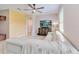 Cozy living room with tile floors, yellow accent wall and a large sectional sofa at 4720 Doral Pointe Dr, Kissimmee, FL 34758