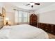Well-lit main bedroom showcasing a neutral color scheme, modern ceiling fan, and decorative furnishings at 4720 Doral Pointe Dr, Kissimmee, FL 34758