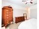Spacious main bedroom with wood floors, two dressers, and a mirror at 4720 Doral Pointe Dr, Kissimmee, FL 34758