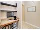 This cozy office space features built-in shelves, granite countertops, and extra storage, perfect for a work-from-home setup at 4720 Doral Pointe Dr, Kissimmee, FL 34758
