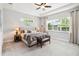 Bright bedroom with neutral tones, tray ceiling, and lots of natural light at 5025 Sunfalls Ave, St Cloud, FL 34772