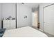 Well-lit bedroom featuring neutral walls, white furniture, and carpeted floor at 5025 Sunfalls Ave, St Cloud, FL 34772