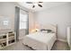 Bright bedroom with a window, features natural light and neutral tones at 5025 Sunfalls Ave, St Cloud, FL 34772