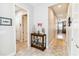 Hallway showcasing a display cabinet with glass shelving and decorated with collectables at 5025 Sunfalls Ave, St Cloud, FL 34772