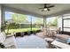 Outdoor living on a lanai with a ceiling fan and a view of the yard at 5025 Sunfalls Ave, St Cloud, FL 34772