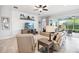 Gathering room with comfortable seating arrangement, large TV, and access to the screened lanai at 5025 Sunfalls Ave, St Cloud, FL 34772