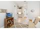 Living room featuring an open floor plan with a media cabinet and decorative rug at 5025 Sunfalls Ave, St Cloud, FL 34772