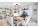 Spacious living room featuring a coastal-themed decor, a large TV, and comfortable seating at 5025 Sunfalls Ave, St Cloud, FL 34772