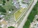 An aerial view showing the lot and neighborhood, with nearby roads, trees and landscaping around the property at 5473 Animosh Ct, Polk City, FL 33868
