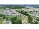 An aerial view showcasing the desirable community, nearby lake, and the location of the available property at 5473 Animosh Ct, Polk City, FL 33868