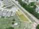 An aerial view showing the lot and neighborhood, with nearby roads, trees and landscaping around the property at 5473 Animosh Ct, Polk City, FL 33868
