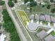 Aerial view of the lot and neighborhood, with nearby roads, trees and landscaping adding value to the property at 5473 Animosh Ct, Polk City, FL 33868