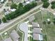 Spacious neighborhood featuring well-maintained homes, green lawns and a cul-de-sac street in an aerial view at 5473 Animosh Ct, Polk City, FL 33868