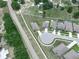 Aerial view of the street showing well-manicured lawns and landscaping adding to the property's curb appeal at 5473 Animosh Ct, Polk City, FL 33868