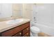 Bathroom with vanity, toilet, and tub-shower combo for convenience at 5473 Animosh Ct, Polk City, FL 33868