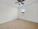 Bedroom offering tile floors, natural light, and a ceiling fan at 5473 Animosh Ct, Polk City, FL 33868