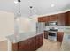 Open kitchen featuring stainless steel appliances, granite countertops, and lots of cabinetry at 5473 Animosh Ct, Polk City, FL 33868