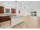 Open kitchen featuring stainless steel appliances, granite countertops, and lots of cabinetry at 5473 Animosh Ct, Polk City, FL 33868